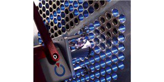 Tube sheet welding in progress. 