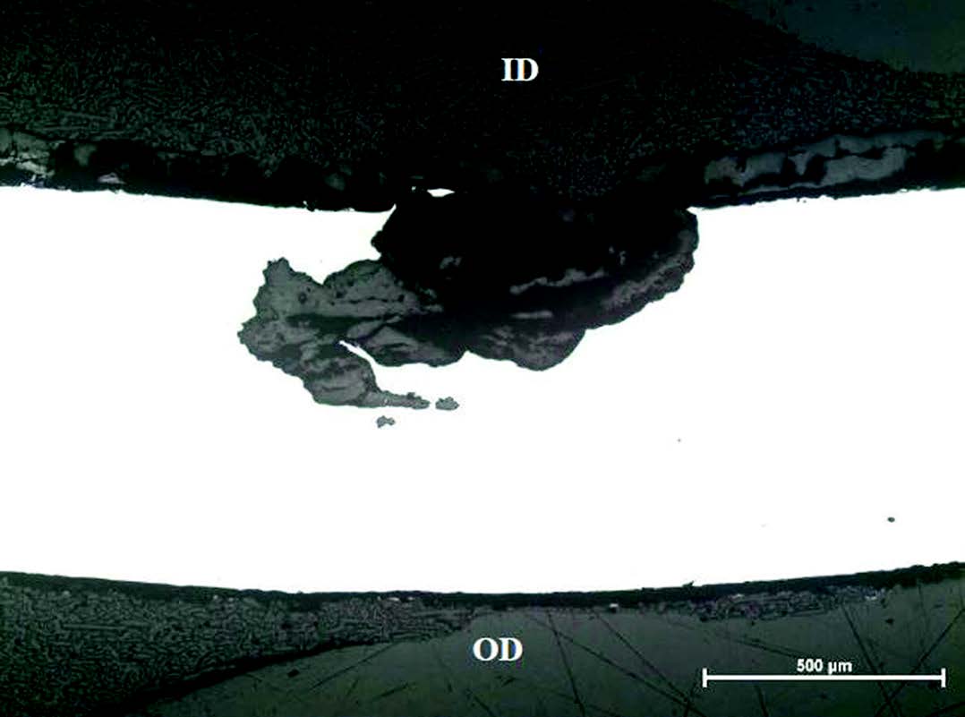 Figure 4. The pit from Figure 4 after grinding approximately another 0.010-in. The tunneling pit was clearly defined with oxide in the pit. Approximately 57% of the wall thickness was lost at the deepest point.