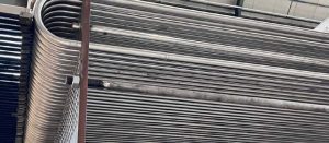 High pressure pool condenser tube bundle at the beginning of the assembling phase where the U tubes made with Safurex material supplied by Alleima to Belleli Energy CPE are aligned and inserted into the holes of the tube plate.