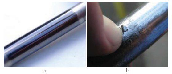 Figure 2: Graphite adhesion on the surface of the stem a) thin graphite film, b) thick graphite layer.