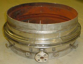 Photo 2. Bellow after removing piping, internal corrosion (reddish), outside no corrosion (metallic). Inner sleeve to protect bellow was removed.