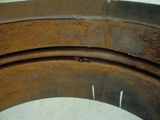 Photo 3. Bellow inside, inner sleeve (see brace) removed and inner layer shows severe corrosion.