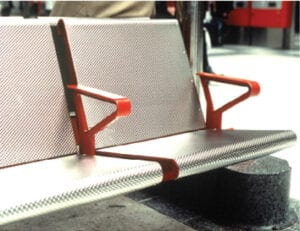 Bus station seat with colourful anodised aluminium arms.
