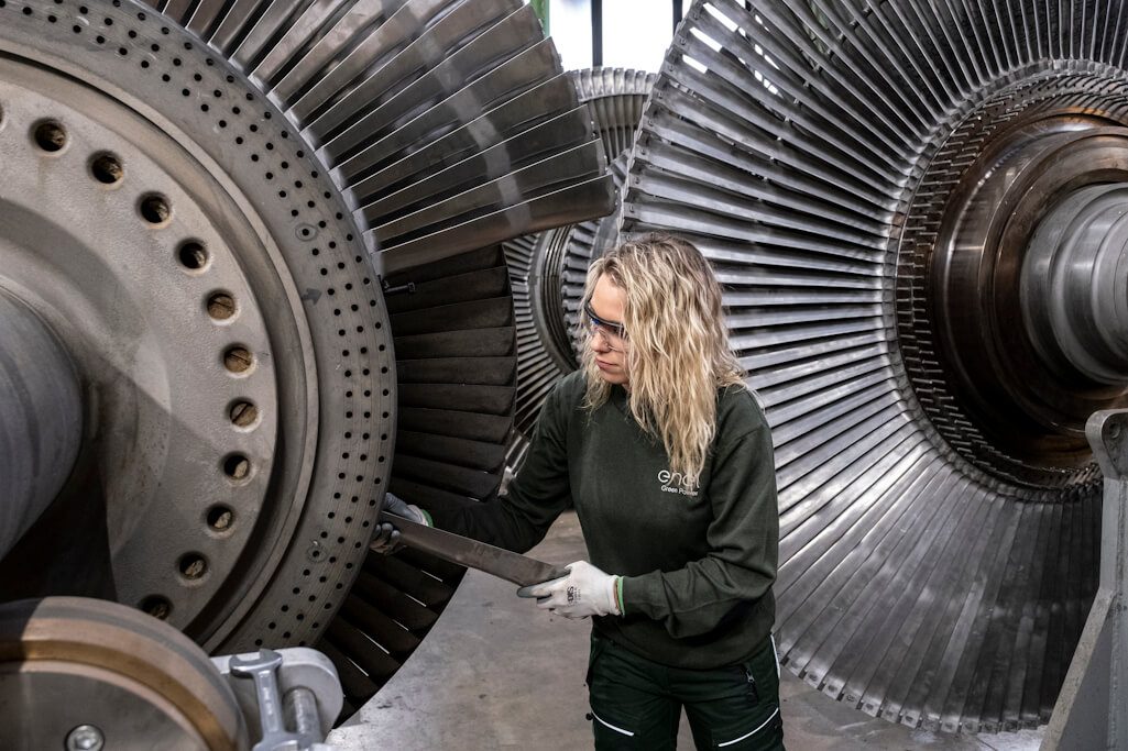 An Enel Green Power employee performs maintenance work on a turbine at one of the power plants in the geothermal district of Larderello, Tuscany. Photo: Enel.