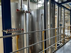 High temperatures required for steam generation, as well as caustic and acidic cleaning agents, necessitate the extensive use of stainless steel throughout the CIP (clean-in-place) system.